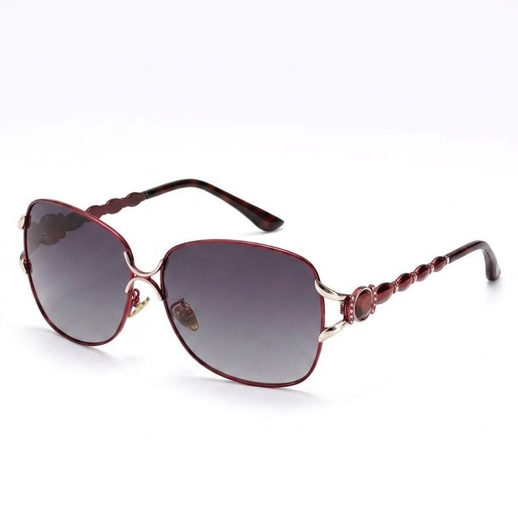 Lifestyle shot of dark red oversized sunglasses on marble cafe table