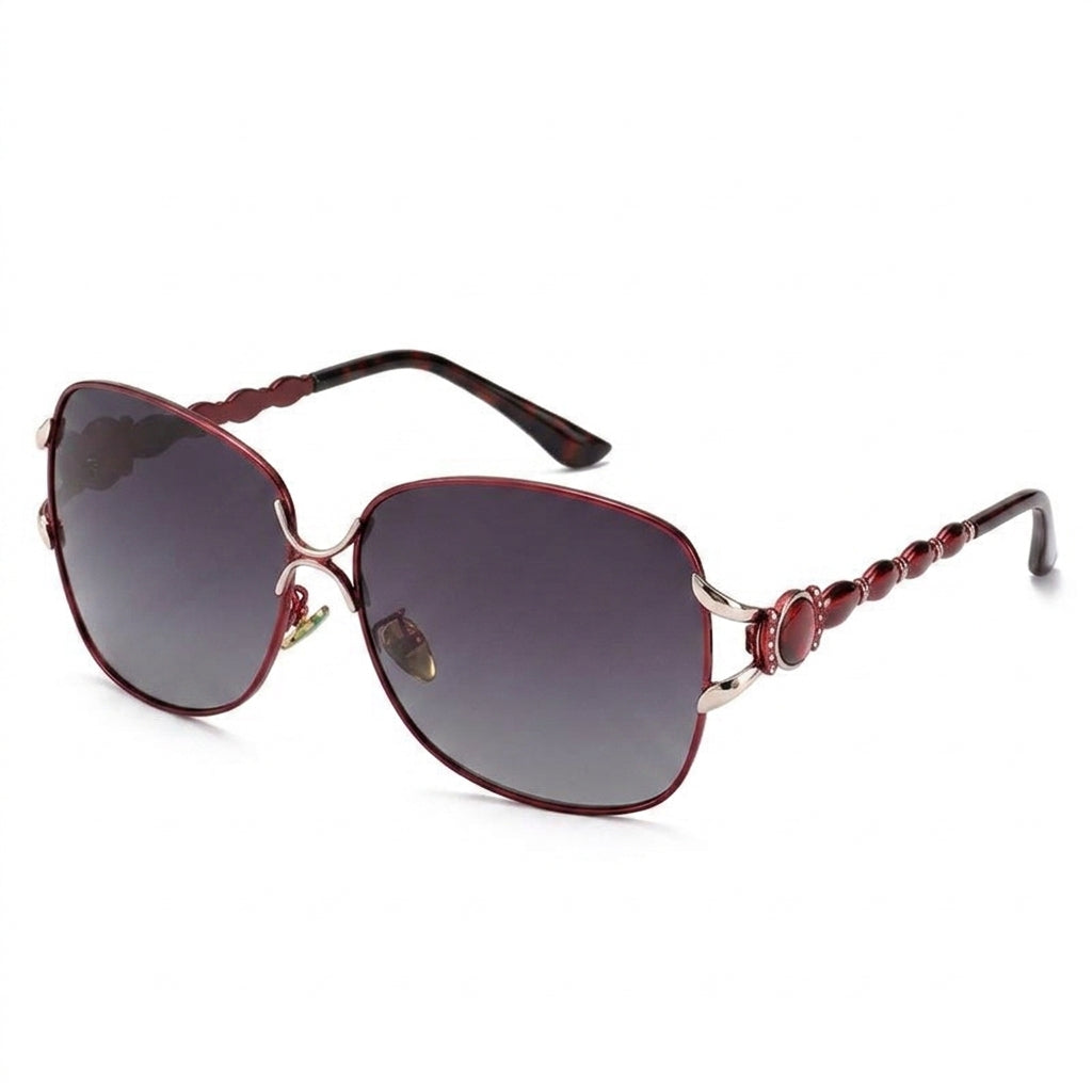 Studio shot of women's dark red oversized butterfly sunglasses with gradient lenses on white background
